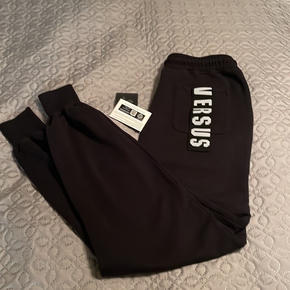 Versace black track pants with logo intarsia at rear pocket